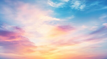Obraz premium A colorful sunset sky with soft pastel pink, orange, and blue clouds