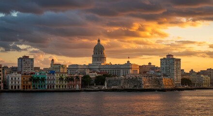 Fototapeta premium Dramatic sunset view of the vibrant cityscape over the ocean
