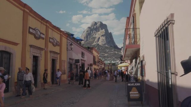 12032025 Bernal Queretaro View of the Pena del Bernal from the town of Bernal, tourist area of ​​Queretaro, Mexico, tourists walking
