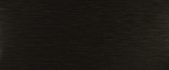 Ribbed lines on black paper surface
