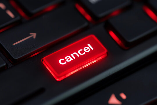 Red button with inscription " cancel  " on keyboard close up detail	