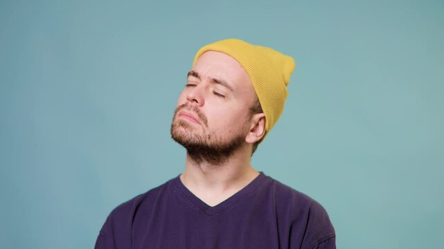 The portrait a man with a distrusting expression, as if he's uncertain about something,