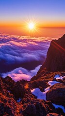 Obraz premium Stunning Sunrise Over Mountain Peaks and Clouds