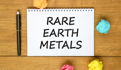 Rare earth metals symbol. Concept words Rare earth metals on beautiful white note. Black pen....