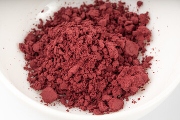 Acai powder circle pile, violet superfood dust, pink fruit flour extract mound