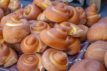Smoked cheese made from cow's milk. A natural, environmentally friendly farm product. Smoked cheese on the counter of the farmer's market. Cheese production.