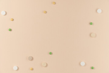 Many different pills on beige background. Flat lay, top view. Copy space