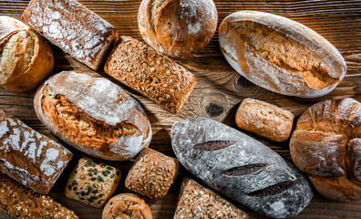 Assorted bakery products including loaves of bread and rolls