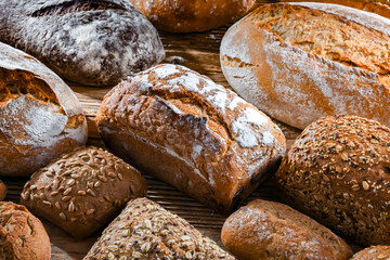 Assorted bakery products including loaves of bread and rolls