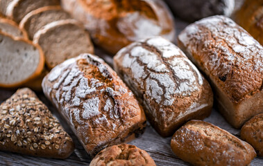 Assorted bakery products including loaves of bread and rolls