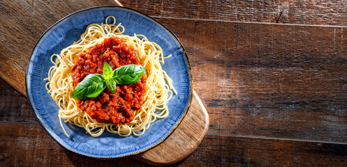 Composition with a plate of spaghetti bolognese