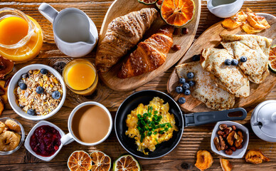 Breakfast served with coffee, eggs, cereals nd croissants