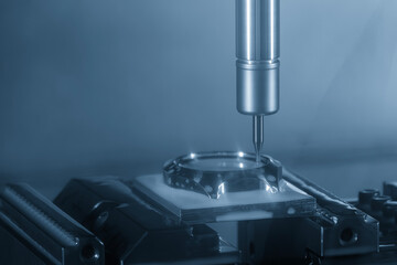 The CNC milling machine mirror surface cutting mold part by solid ball nose end mill tool.