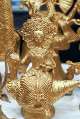 Intricately designed Dhokra handicrafts for sale at a craft fair in Kolkata. Dokra, a primitive form of art, where Brass (or bronze) made figurines are made from lost wax casting process.