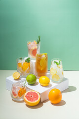 Summer cold cocktails with fruits and ice in glass glasses