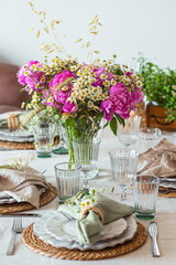 Shavuot table setting. Herbs table decorations for holidays and dinner