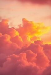 Fototapeta premium Fiery orange and pink clouds, soft wispy texture at sunset, twilight, colorful