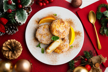 Delicious Spanish dessert LECHE FRITA traditional to prepare for the Easter holiday. Top view table with christmas decoration.