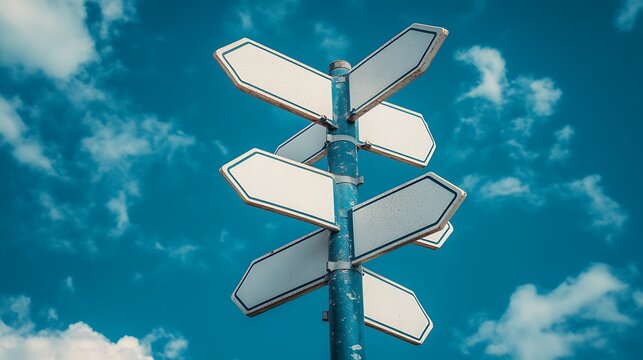 Naklejki Blank signpost against blue sky.