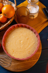 orange fruit cake dough. Orange cake recipe. Vertical