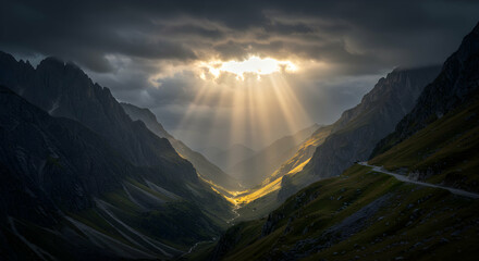 Obraz premium Sun Rays Shining Through Dramatic Mountain Valley Landscape