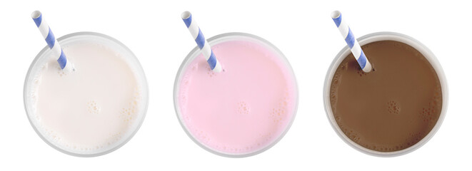 Milk of different flavors in glasses isolated on white, top view. Vanilla, chocolate and strawberry