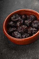 Dried prunes drained smoked plum delicious gourmet food background on the table rustic food top view copy space keto and paleo diet vegetarian and vegan food