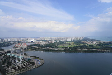 Fototapeta premium Aerial view of Supertree Grove at Gardens by the Bay in the Marina Bay area Singapore showcasing futuristic architecture lush greenery and iconic urban nature design