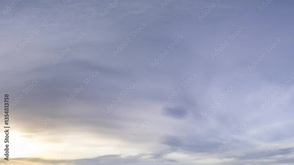Wall mural cloudscape panorama: a seamless loop of gently moving clouds at dawn