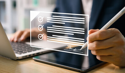 Concept of electronic signature, Electronic signature businessman use a stylus to sign electronic...