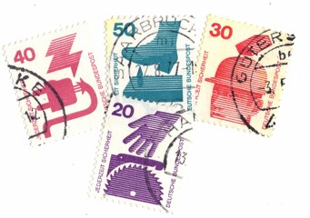 A set of vintage postage stamps from Germany on a white background.