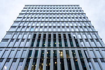 Symmetrical view of a modern office building with repetitive window pattern
