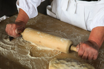 Rolling out the dough with the rolling pin