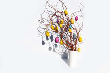 Paastakken branch yellow pink egg white background sun Easter Europe twig