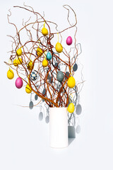 Paastakken branch yellow pink egg white background sun Easter Europe twig