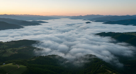 Fototapeta premium Fog Covering Valley at Sunrise in Mountain Landscape Aerial View