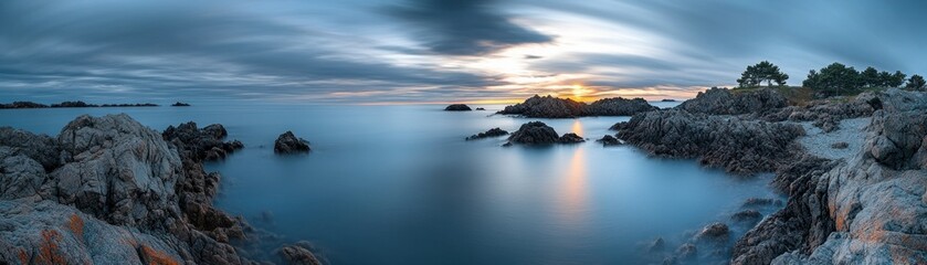 Obraz premium A coastal panoramic view shows water meeting the rocky shore