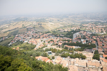 Fototapeta premium An awe-inspiring aerial view of San Marino, capturing the layout of the city and its picturesque surroundings from above.