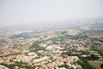 An awe-inspiring aerial view of San Marino, capturing the layout of the city and its picturesque...