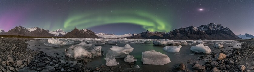 Naklejka premium Vibrant Northern Lights Shine Over Icy Mountainous Landscape At Night