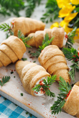 Spring carrot-shaped snacks made of shortcrust pastry with creamy-herb filling. Easter food concept