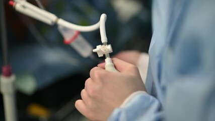 The surgical team is preparing and organizing equipment in the operating room for surgery