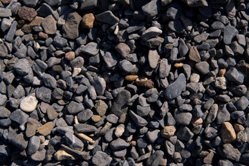 Gravel forming a textured background in switzerland's suburbs