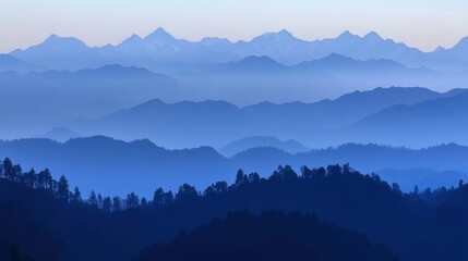 Fototapeta premium Blue mountain range silhouettes captured at twilight or dusk