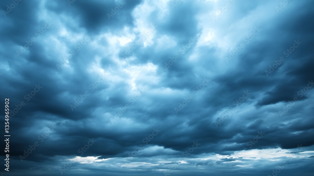 Poster dramatic cloud formation in a moody sky showcasing various shades of blue and gray during twilight h