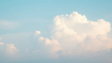 Fototapeta premium Softly glowing clouds against a pale blue sky, peaceful atmosphere, white clouds