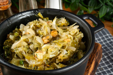Stewed cabbage with onion and greaves.
