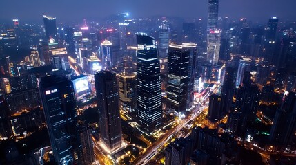 Obraz premium Aerial View of a Bustling City Beautifully Lit Up at Night with Skyscrapers and Roads : Generative AI
