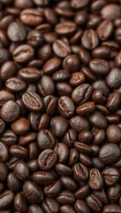 Obraz premium Close-up of dark roasted coffee beans, rich texture, espresso, background