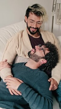 Vertical video, Gay Couple Relaxing Together At Home